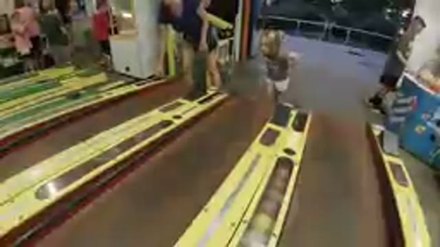 COLORADO, UNITED STATES-2019: Mother & Daughter Playing Skee-Ball