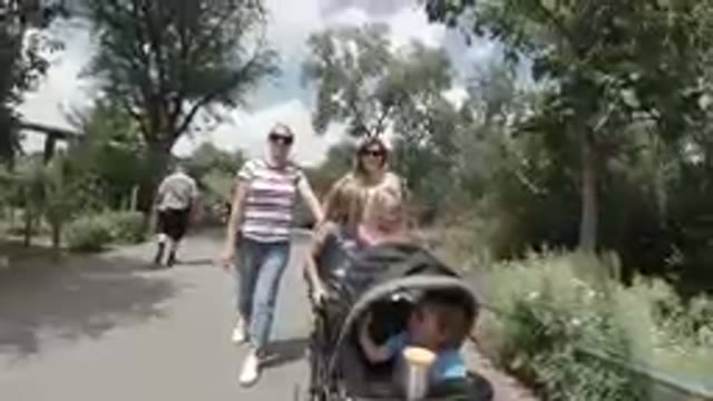 September 29, 2019-Denver, Colorado. Two Women With A Stroller Walking