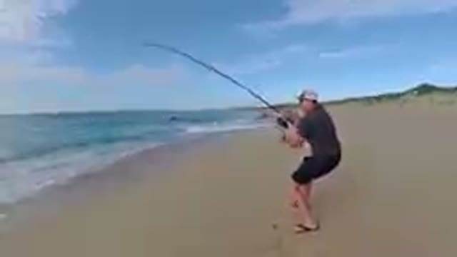 Los Cabos, Mexico-2019: Man Catching Fish on Tropical Beach
