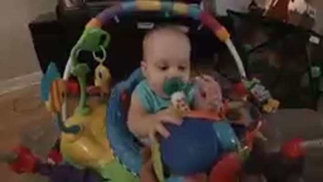 Baby Boy Feeling Curious of his Colored Ball
