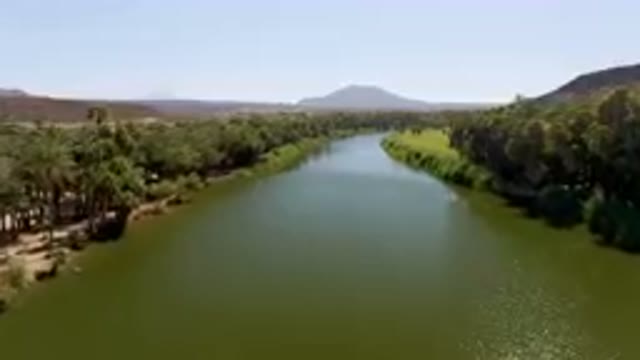 SAN IGNACIO BCS MEXICO-2023: River With A Mountain In The Background
