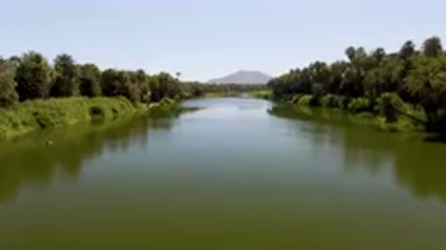 SAN IGNACIO BCS MEXICO-2023: River With Trees And A Mountain In The Background