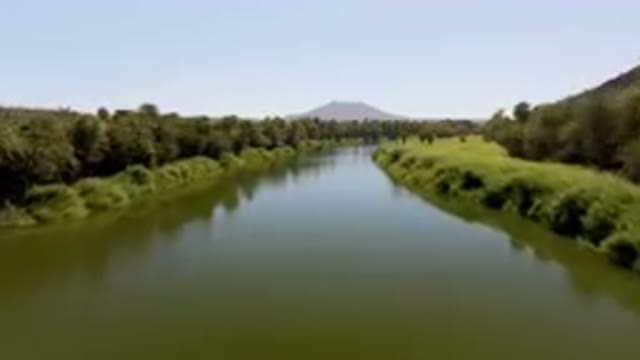 SAN IGNACIO BCS MEXICO-2023: River With A Green Bank And Trees