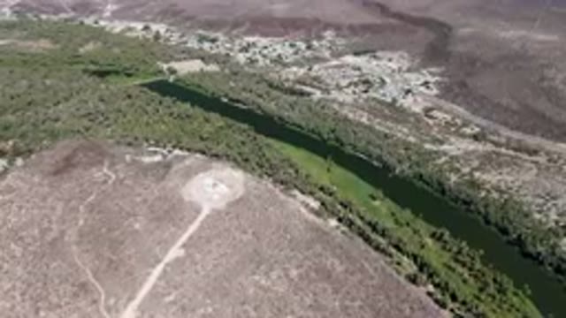 SAN IGNACIO BCS MEXICO-2023: Aerial River Running Through A Valley Surrounded By