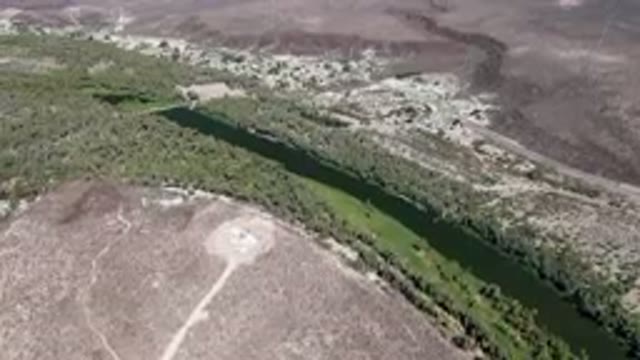 SAN IGNACIO BCS MEXICO-2023: Aerial River Running Through A Dry Landscape With A