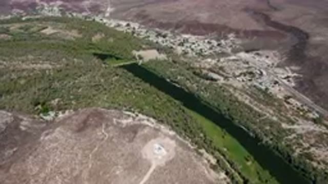 SAN IGNACIO BCS MEXICO-2023: Aerial River Running Through A Valley Surrounded By