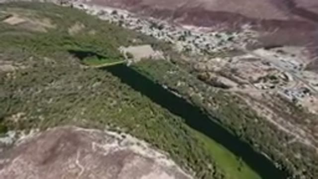 SAN IGNACIO BCS MEXICO-2023: Aerial River Running Through A Valley Surrounded By
