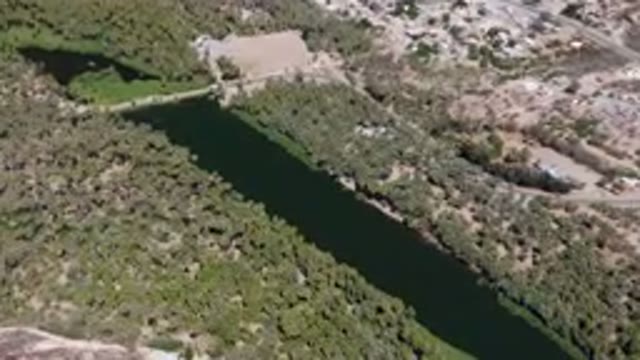 SAN IGNACIO BCS MEXICO-2023: Aerial River Running Through A Lush Green Valley