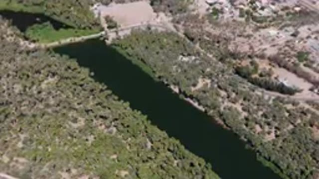 SAN IGNACIO BCS MEXICO-2023: Aerial River Running Through A Lush Green Forest