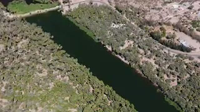 SAN IGNACIO BCS MEXICO-2023: Aerial River Running Through A Forest Filled With