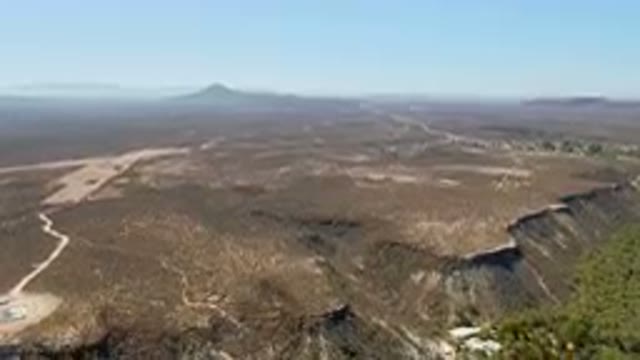 SAN IGNACIO BCS MEXICO-2023: Barren Area With A Road And A Mountain