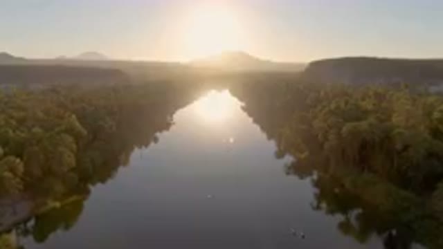SAN IGNACIO BCS MEXICO-2023: River With A Boat In It And A Sun Setting