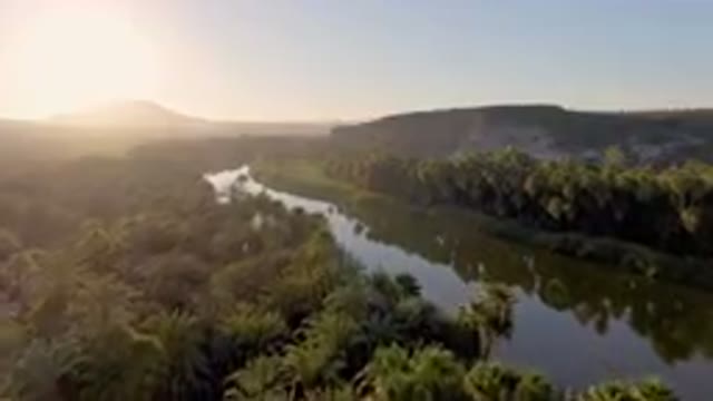 SAN IGNACIO BCS MEXICO-2023: River With Trees And Mountains In The Background