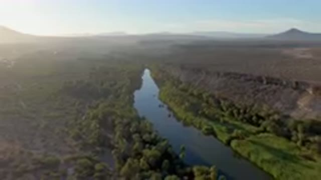 SAN IGNACIO BCS MEXICO-2023: River Running Through A Lush Green Valley