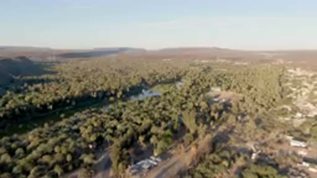 SAN IGNACIO BCS MEXICO-2023: Aerial River Running Through A Lush Green Valley