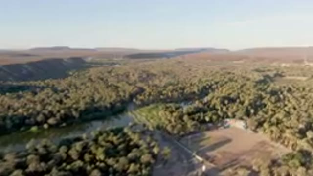SAN IGNACIO BCS MEXICO-2023: Aerial River Running Through A Forest Filled With