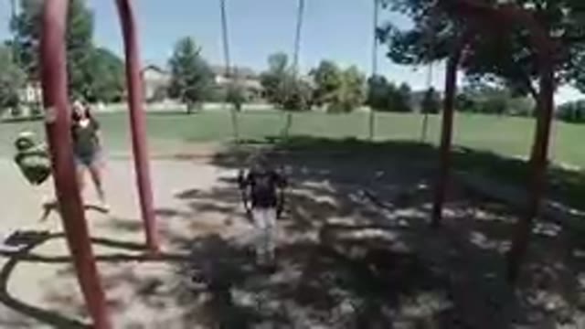 October 5, 2019. Denver , Colorado. Happy Little Girl Swinging