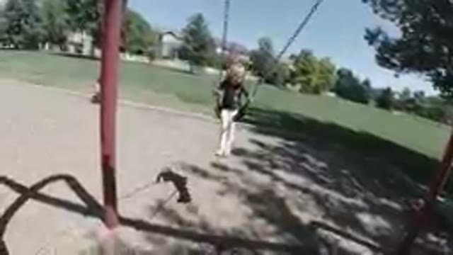 October 6, 2019. Denver, Colorado- Little Girl Swings Happily