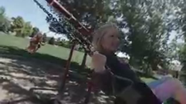 Denver, Colorado. October 6, 2019- Little Girls on A Swing Set