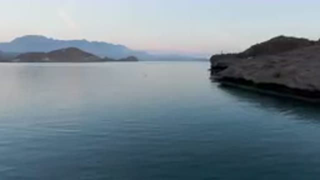 DANZANTE BAY LORETO BCS MEXICO-2023: Small Boat Floating On Calm Waters