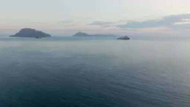 DANZANTE BAY LORETO BCS MEXICO-2023: Many Boats in the Water Near a Rocky Shore