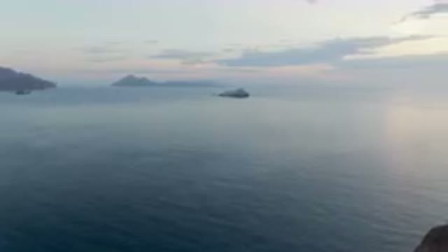DANZANTE BAY LORETO BCS MEXICO-2023: Boat Sailing in Water Near the Horizon