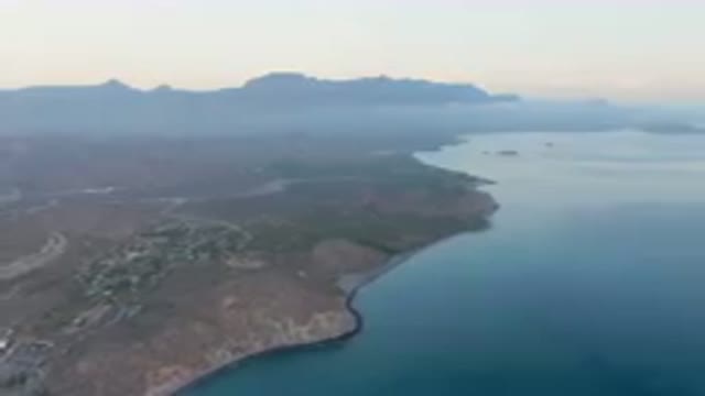 DANZANTE BAY LORETO BCS MEXICO-2023: Large Body Of Water With A Small Town In