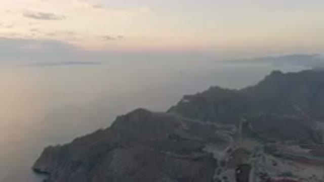 DANZANTE BAY LORETO BCS MEXICO-2023: Mountain With A Road And A Body Of Water