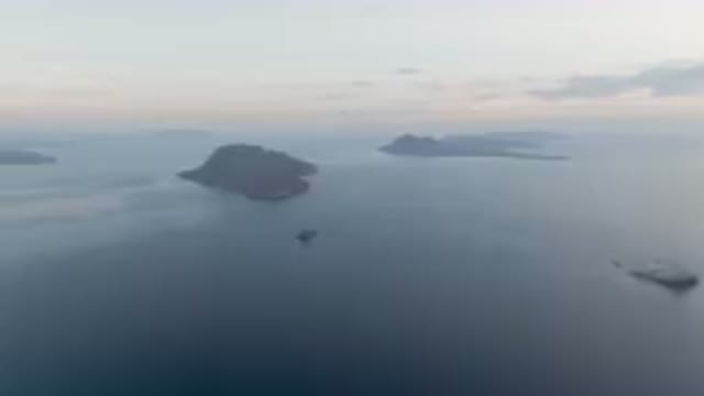 DANZANTE BAY LORETO BCS MEXICO-2023: Body Of Water With A Boat In The Middle