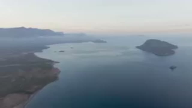 DANZANTE BAY LORETO BCS MEXICO-2023: Body Of Water With A Small Island In The