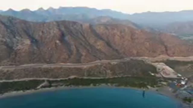 DANZANTE BAY LORETO BCS MEXICO-2023: Mountains And A Road In The Distance With A
