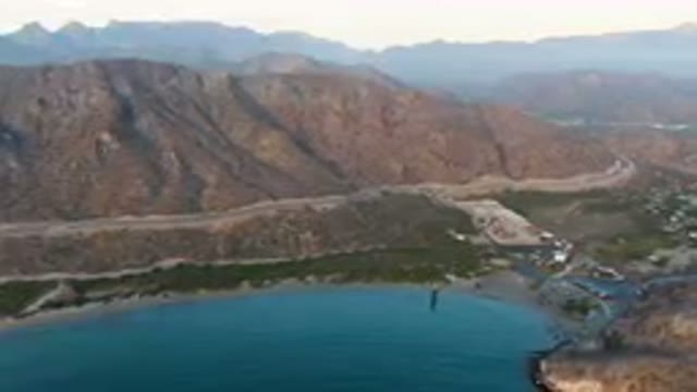 DANZANTE BAY LORETO BCS MEXICO-2023: Mountains Surrounding A Body Of Water With