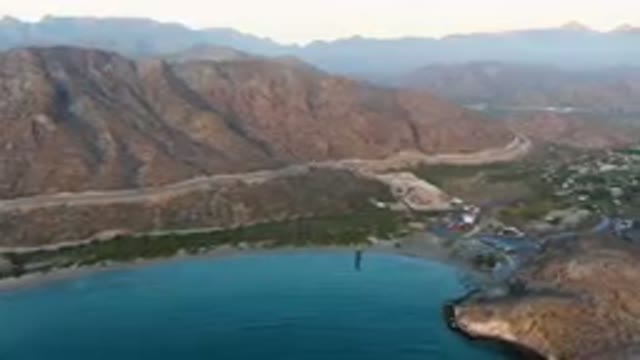 DANZANTE BAY LORETO BCS MEXICO-2023: Mountains Surrounding A Body Of Water With