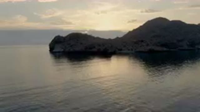 DANZANTE BAY LORETO BCS MEXICO-2023: Small Boat In The Water Near A Mountain