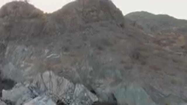 DANZANTE BAY LORETO BCS MEXICO-2023: On A Rocky Mountain With A Body Of Water In