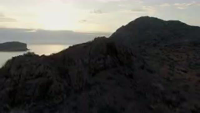 DANZANTE BAY LORETO BCS MEXICO-2023: Rocky Cliff With A Body Of Water