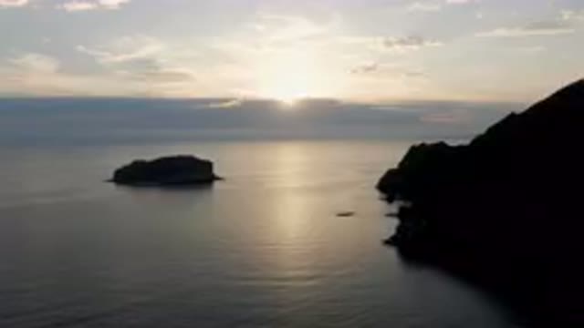 DANZANTE BAY LORETO BCS MEXICO-2023: Body of Water With a Rock in the Middle