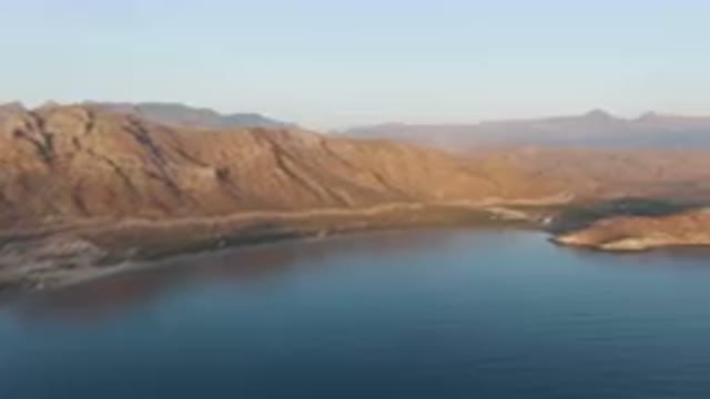 DANZANTE BAY LORETO BCS MEXICO-2023: Mountains And A Body Of Water With A Small Island