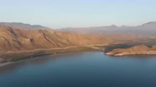 DANZANTE BAY LORETO BCS MEXICO-2023: Mountains And A Body Of Water With A Small Island