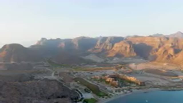 DANZANTE BAY LORETO BCS MEXICO-2023: Mountains Surrounding A Lake And A City