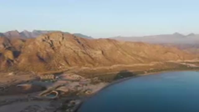 DANZANTE BAY LORETO BCS MEXICO-2023: Mountains Surrounding A Body Of Water With