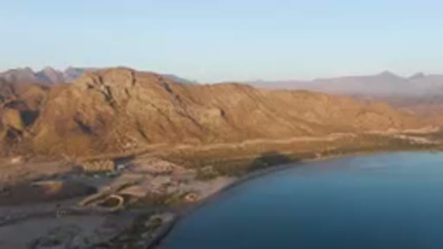DANZANTE BAY LORETO BCS MEXICO-2023: Mountains Surrounding A Body Of Water With
