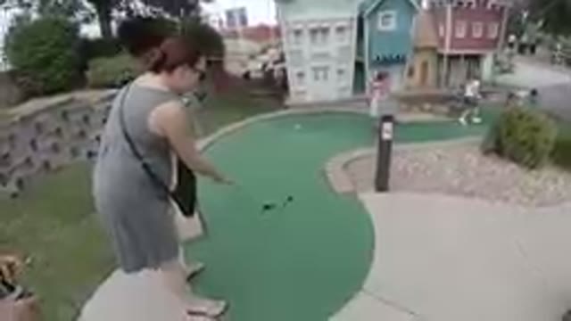October 6, 2019. Denver, Colorado-Woman Playing Miniature Golf