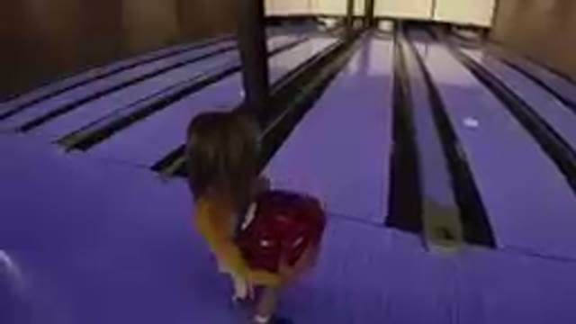 Little Girl Plays Bowling