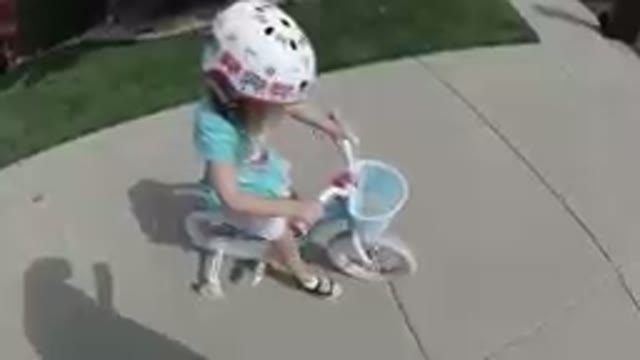 COLORADO, UNITED STATES-2019: Little Girl Learns to Ride a Bicycle