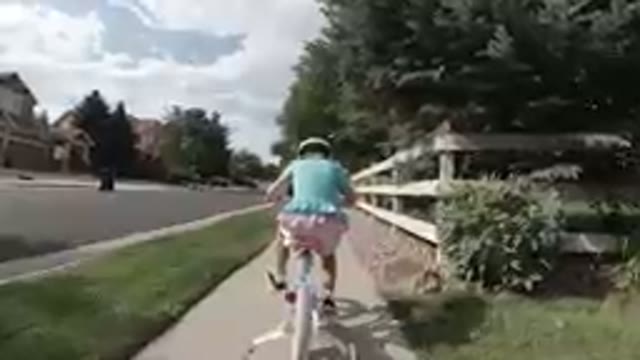 Little Girl Biking Independently