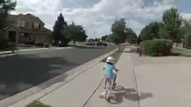 Little Girl Biking Alone