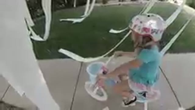 COLORADO, UNITED STATES-2019: Little Girl Riding A Bike With A Helmet On