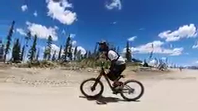 COLORADO UNITED STATES-2019: Mountain Bikers Riding Past Child On Trail