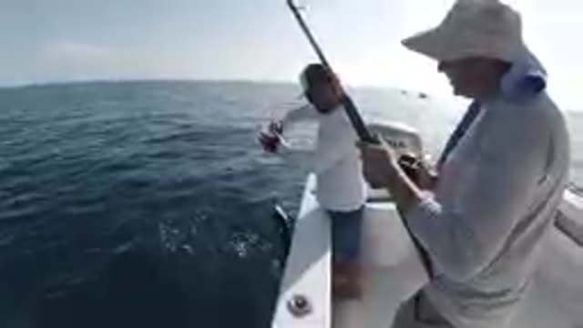 CABO BAJA CALIFORNIA SUR MEXICO-2019: Man and Boy Fishing on Boat